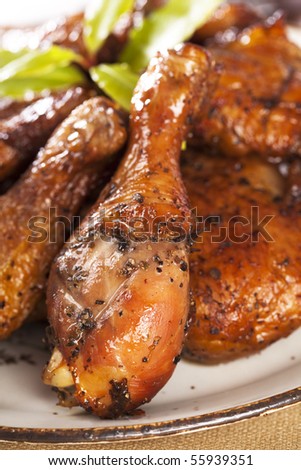 homemade smoked  chicken drumstick on a plate, shallow DOF