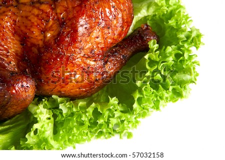 homemade hot smoked  quarter chicken on leaf lettuce bed isolated on white
