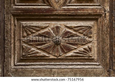 old ornamental design in wood, wooden carved door detail