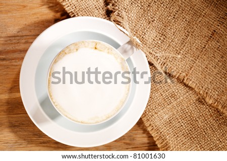 hot frothy drink cappuccino coffee, rustic style, shallow dof