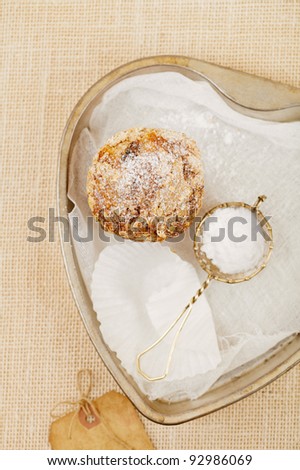healthy muffin, cake wraps and sieve with caster sugar