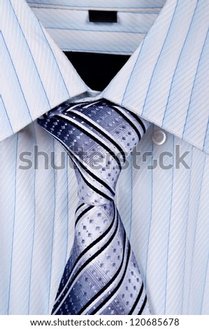 Men\'s shirt with matching neck tie isolated on white background
