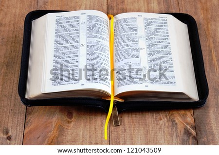 Russian Bible in the light wooden background
