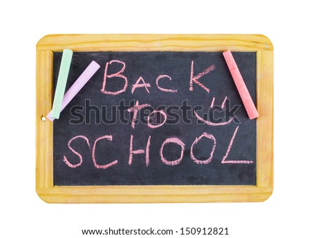 The words \'Back to School\' written on the small school desk