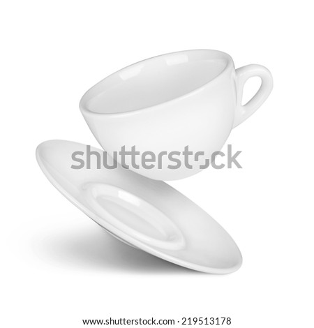 falling coffee cup and saucer on the isolated white background
