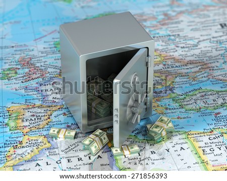 Money on the world. Steel safe with money on the world map. international banking concept.