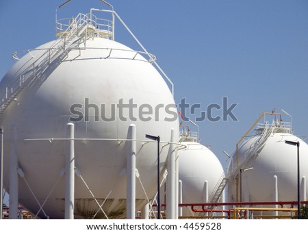 Detail from very big round containers of fuel