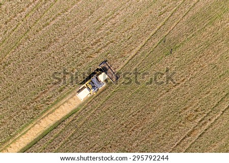 Combine Harvesting a Fall Corn Field Aerial