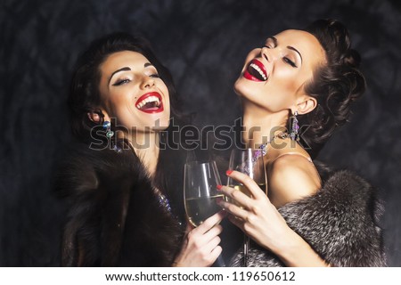 Young happy fashion women celebrating the event Congrats Young happy fashion women celebrating the event Congrats
