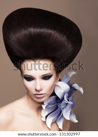 Updo. Young Beautiful Woman Brunette With Perfect Glossy Brown Hair. Glamor