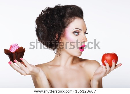 Surprised Funny Woman Decides Between Apple And Cake