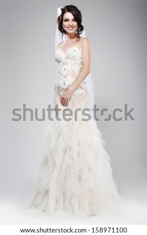 Wedding Style. Sophisticated Newlywed in White Bridal Dress. Elegance