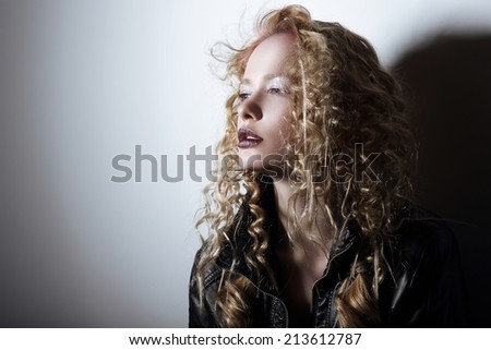 Portrait of Young Woman with Frizzy Hair