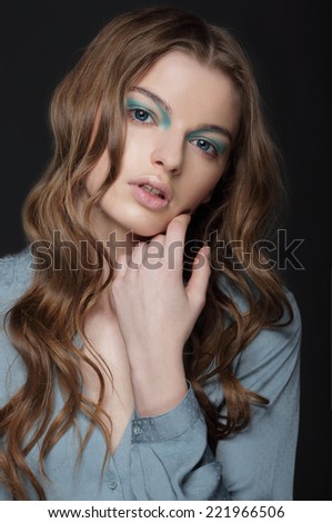 Fantasy. Young Brunette with Unusual Blue Eye Make-up
