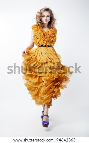 http://image.shutterstock.com/display_pic_with_logo/900991/900991,1328690821,1/stock-photo-beautiful-woman-blonde-fashion-model-in-yellow-dress-isolated-over-white-background-shopping-mall-94642363.jpg