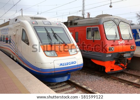 St. Petersburg, Russia - March 16, 2013: Allegro train (Saint Petersburg, Russia - Helsinki, Finland) and suburban train Saint-Petersburg - Vyborg