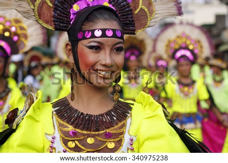 SAN PABLO CITY, LAGUNA PHILIPPINES - JANUARY 2012: Female street dancer smiles as she dances along Rizal Avenue during the 17th Annual  Coconut Festival Celebration. \