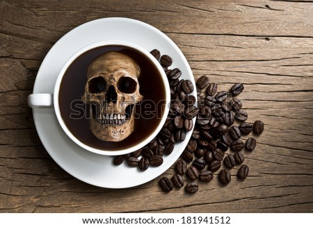 Still life photography, human skull soak in white coffee cup in harmful effect from Caffeine concept