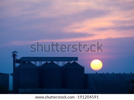 beautiful heavenly with sunset over the rice mill factory