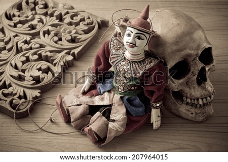 tradition Myanmar style string puppet for tourist souvenir with skull and wood carve in vintage color tone