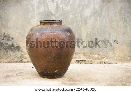 old pottery water jar