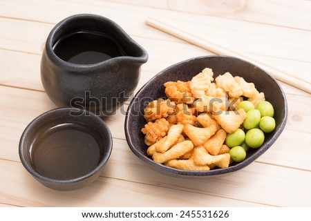 Japanese tea cup with rice cracker and wasabi string bean ( Japanese style snack )