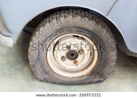 old car with leak out damage tire