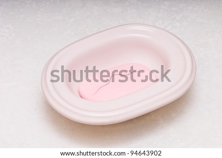 soap in ceramic tray with pubic hair