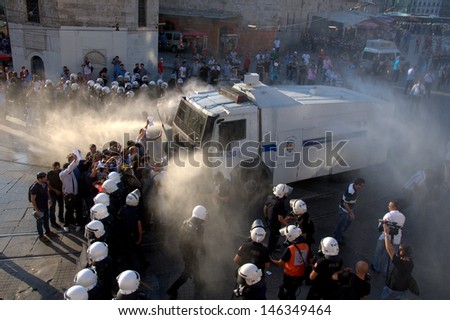 ISTANBUL - JULY 06: Police forces interfere Taksim Solidarity and Republican People\'s Party (CHP) deputy chairman, Gursel Tekin  during Gezi Park protests on July 06, 2013 in Istanbul, Turkey.