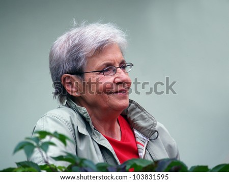 Active old modern woman with glasses