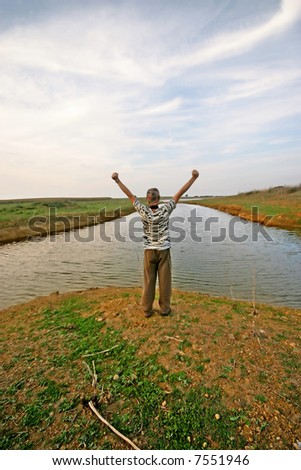 man with arms wide open