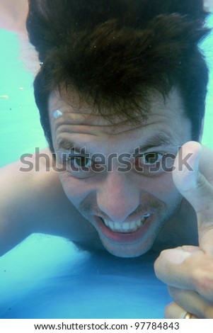 man underwater in the pool, underwater photo