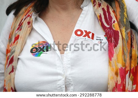 GREECE, Thessaloniki JUNE 29, 2015: Greek crisis. A Pro-government supporter of the NO vote in the upcoming referendum protest with stickers reading NO (OXI in greek) during a rally in Thessaloniki