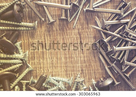 Set of screws and nails. Image cross processed for vintage look.