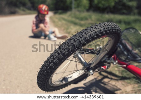 Bicycle accident. Kids safety concept. Selective focus toned image with shallow depth of field