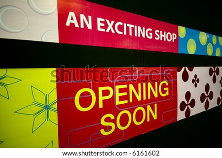 An Opening Soon signage at a shopping mall