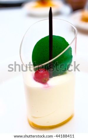 Mango mousse dessert in a glass cup