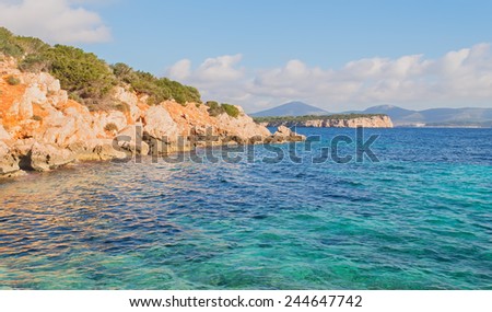 orange rocks in the turquoise sea of Cala Dragunara