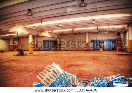 wooden crate boxes in an empty warehouse