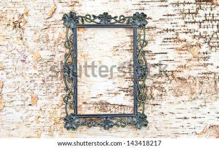 Vintage frame on rustic wooden background made from birch