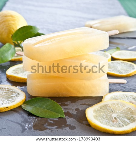 Fresh lemon popsicles on slices of organic lemons