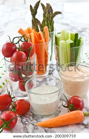 Variety of fresh vegetable sticks and dips