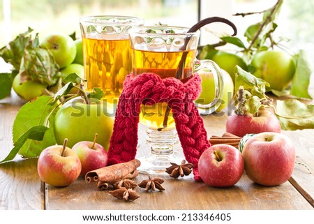 Hot apple cider with winter spices and apples