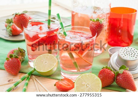 Homemade strawberry lemonade or sangria with fresh lime