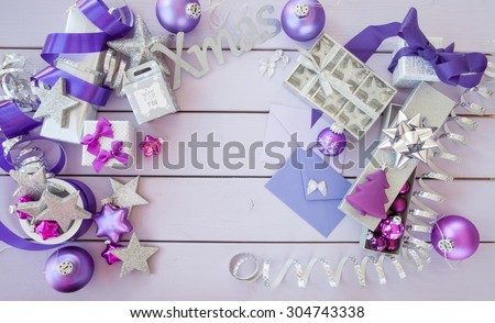 Christmas background with purple xmas ornaments and baubles