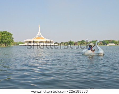 BANGKOK, THAILAND - MARCH 4: Unidentified people enjoy their resting on swan boat in the lake of Suanluang RAMA IX public park on March 4, 2014 in Bangkok, Thailand.