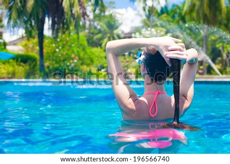 young beautiful woman relaxing in spa pool