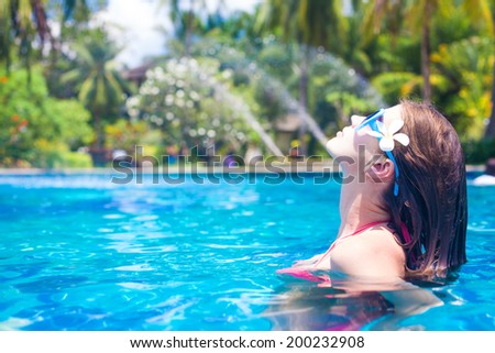young beautiful woman relaxing in spa pool