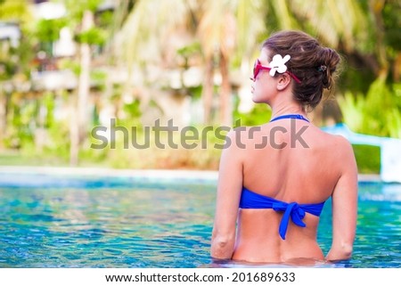 young woman relaxing in spa pool