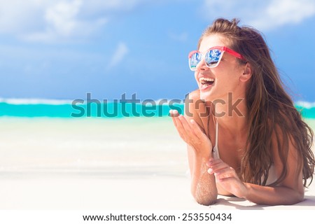 long haired girl in bikini on tropical barbados beach